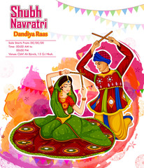 Wall Mural - Couple performing Garba dance in Dandiya Raas for Dussehra or Navratri