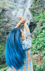 Poster - Girl standing in front of waterfall.