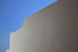 Fototapeta  - Muro bianco, cielo azzurro