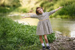 © javiindy - Little girl in nature stream wearing beautiful dress