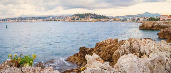 Wall Mural - The rough coast of the city Nice in France shot at first sunlight.