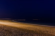 A beach on the mediterranean coast at night