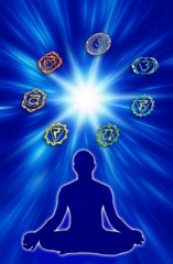 Wall Mural - chakra seven chakras with silhouette of a man over a blue background with star like a concept of med