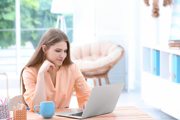 Canvas Print - Young woman working at home