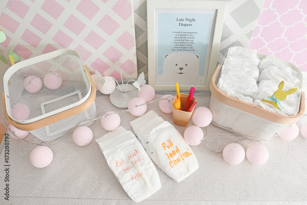 Diapers for game on table at baby shower party