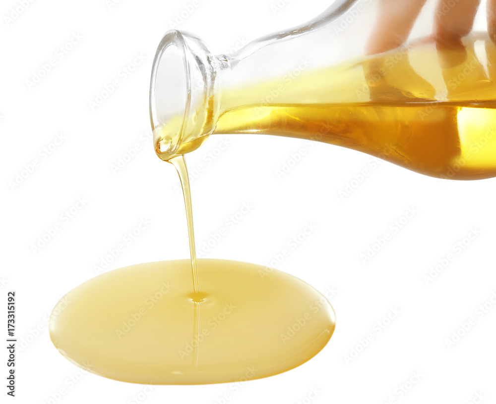 Spilling cooking oil on white background