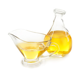 Sticker - Gravy boat and jug with cooking oil on white background