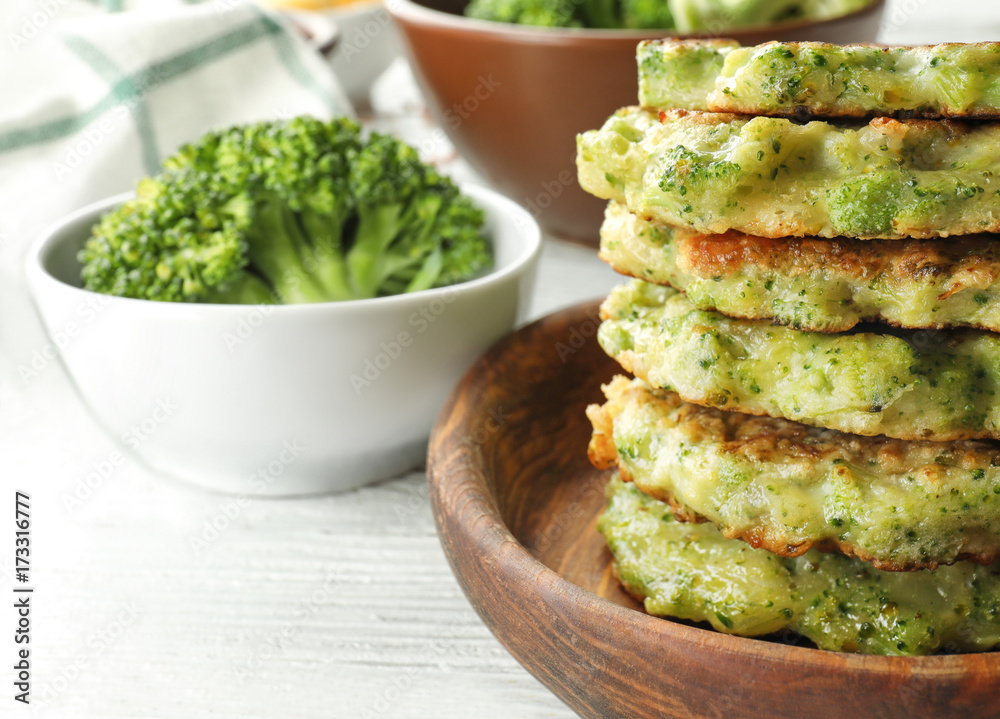 Delicious broccoli pancakes on table, close up