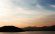 The silhouette of boat and mountain with gradient sunset