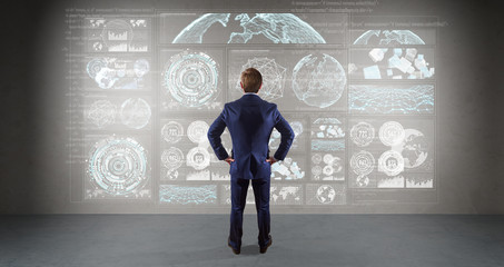 Poster - Businessman using graph screens interface on a wall 3D rendering