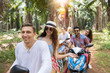 © mast3r - Young Couples Driving Scooter Freedom and Adventure Concept Young People Travel Through Tropical Forest Cheerful Friends Group Enjoy Road Trip Together