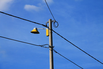 Electricity post with street lighting 