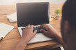 © Prostock-studio - African-american businessman in office type on laptop