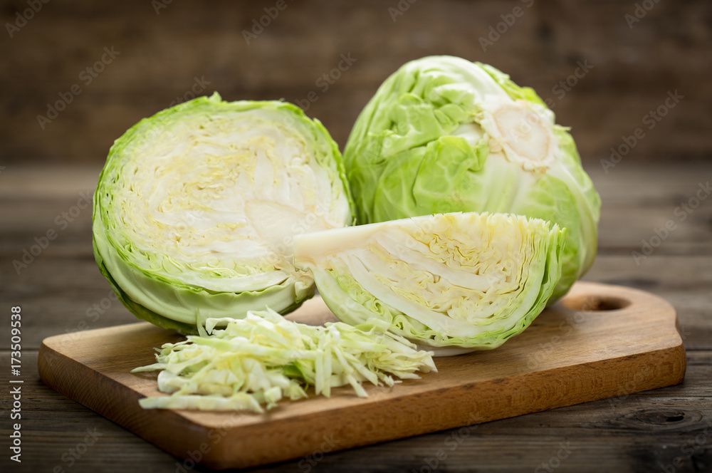 Fresh cabbage on the wooden table - obrazy, fototapety, plakaty 