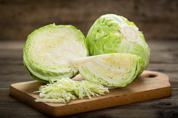 Wall Mural - Fresh cabbage on the wooden table