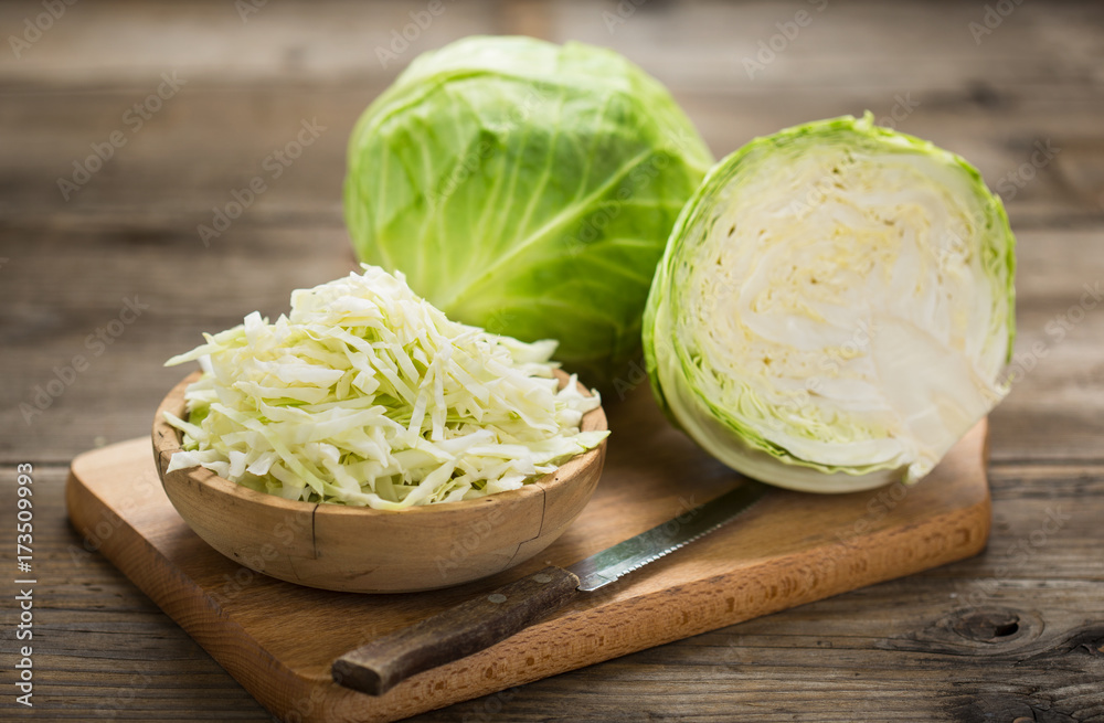 Fresh cabbage on the wooden table - obrazy, fototapety, plakaty 
