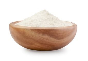 Flour in a wooden bowl isolated