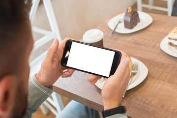 Poster - Watching movie or read news on smart phone in horizontal position with isolated screen for mockup.