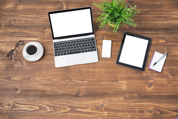 Laptop and tablet computer on wooden background