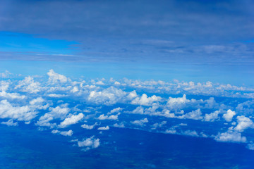 Wall Mural - view of cloud and sky from the windows of airplane flying in sunny day at attitude 32000 feets