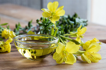 Wall Mural - Evening primrose oil in a glass bowl