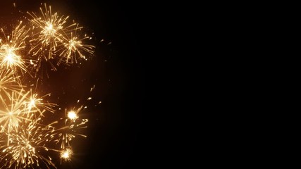 Wall Mural - Yellow firework explosions on edge. Computer designed seamless loop christmas animation with free space 4k (4096x2304)
