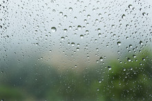 Raindrops On The Glass, Blurry Landscape On Background