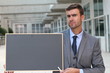 © ajr_images - Upset businessman showing a blackboard with space for copy