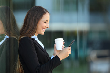 Sticker - Profile of an executive using a smart phone on the street