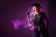 © Grispb - Girl in the smoke of an electronic cigarette. ( vaping ) e-cigarette.