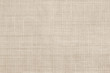 Jute hessian sackcloth canvas woven texture pattern background in light beige cream brown color
