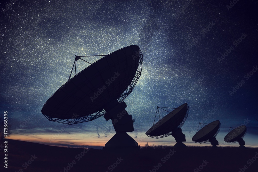 Silhouettes of satellite dishes or radio antennas against night sky. Space observatory. - obrazy, fototapety, plakaty 