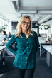 © Jacob Lund - Smiling mature female standing in office