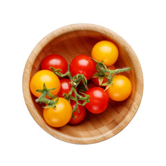 Wall Mural - Red and yellow small cherry tomatoes in wooden bowl isolated on white background.