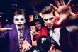 © VadimGuzhva - Halloween party. Adult people in terrible costumes for a party for Halloween posing with scary faces