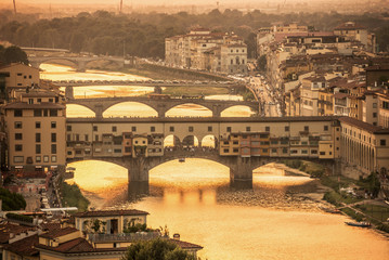 Fototapete - Aerial view of Florence at sunset  with the Ponte Vecchio and the Arno river, Tuscany, Italy