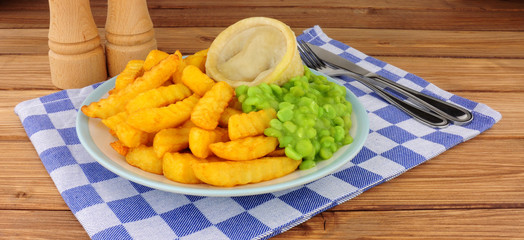 Wall Mural - Steak and kidney pudding meal with chips and mushy peas