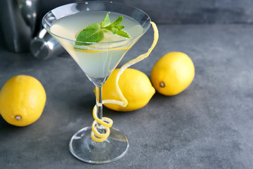 Canvas Print - Glass of lemon drop martini with zest on table