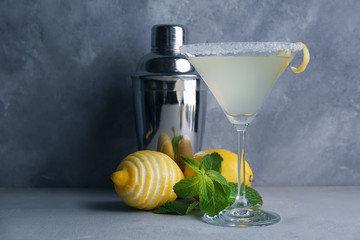 Canvas Print - Glass of lemon drop martini with zest on table