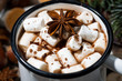 mug of hot chocolate with marshmallows and sweets on wooden table, top view