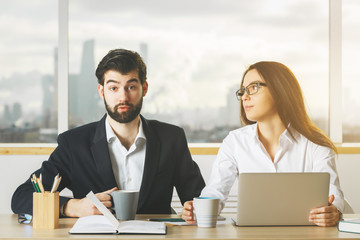 Canvas Print - Thoughtful man and woman working together