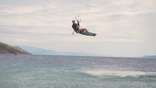 Kite Surfer Rides On The Waves Of The Adriatic Sea. Croatian