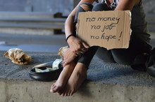 A Homeless Punk Woman Begging, Holding A Sign - No Money No Job No Hope 