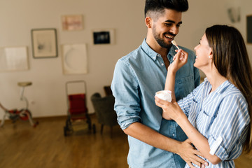 Beautiful couple in love having fun at home