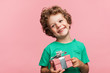 Charming kid with gift box