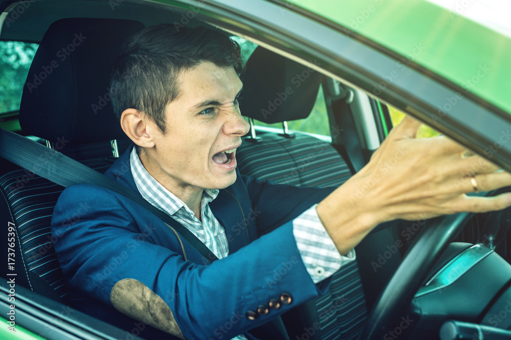 Angry man driver screaming in the car. Quarrel and dissatisfaction on ...