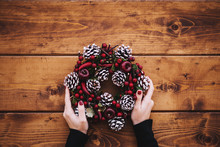 Woman's Hands Holding Holiday Decorations