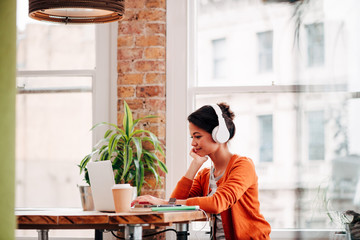 Ambitious Businesswoman working on technology laptop device at work startup