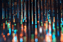 An Abstract Photograph Of Orange, Blue, And Green Colorful Led Lights