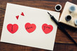 © Gabriel (Gabi) Bucataru/Stocksy - I love you' message hand written on red paper hearts''I love you' message hand written on red paper hearts'' love you' message hand written on red pa''love you' message hand written ''ove you' message hand ''ve you' messag''e you' '' '